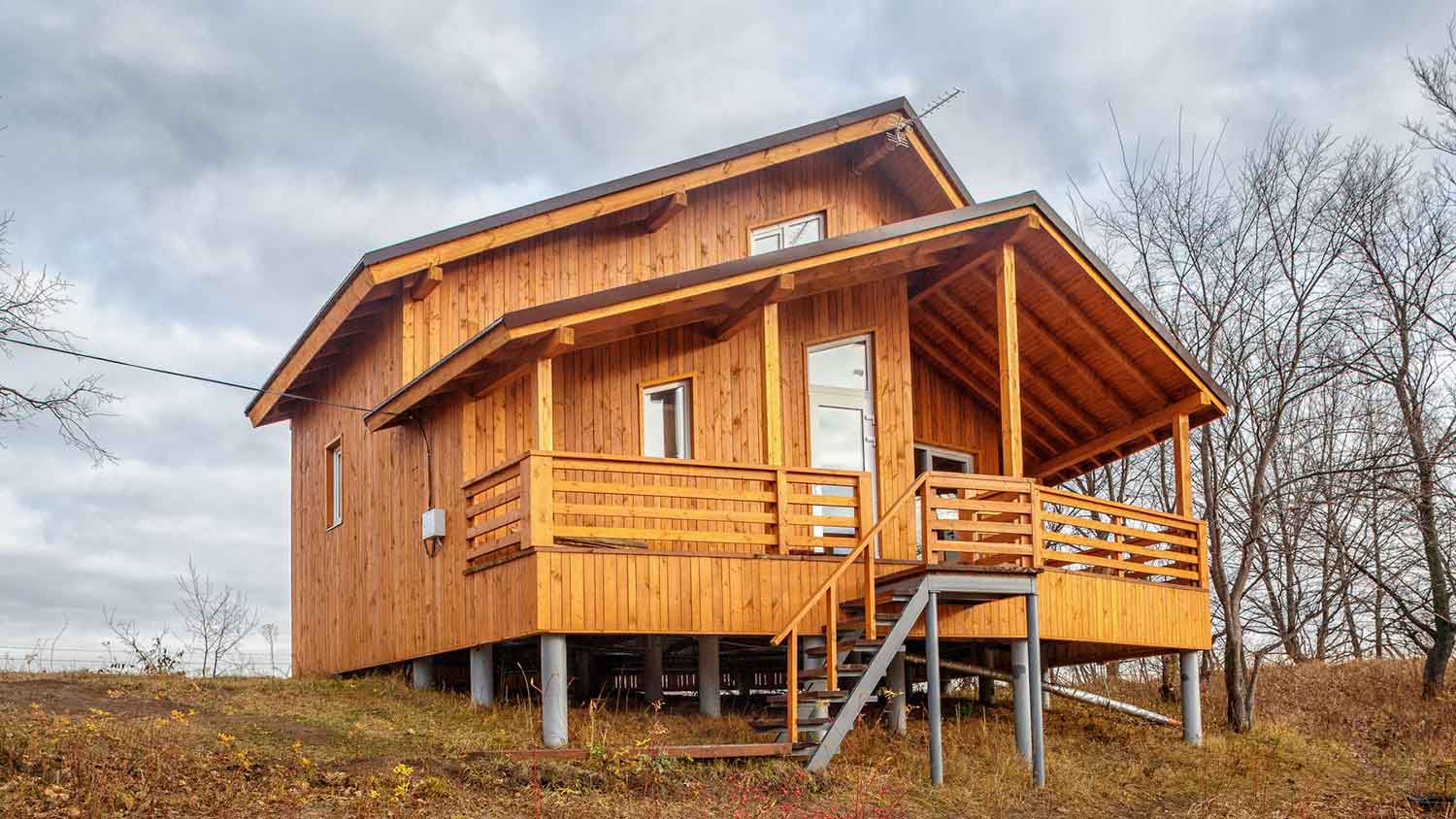 Modern wooden house with a raised foundation
