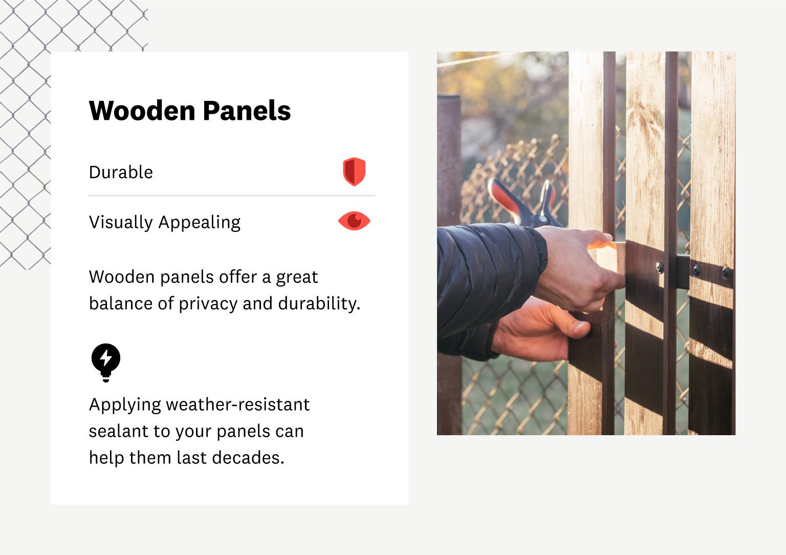 man installing wooden panels on fence