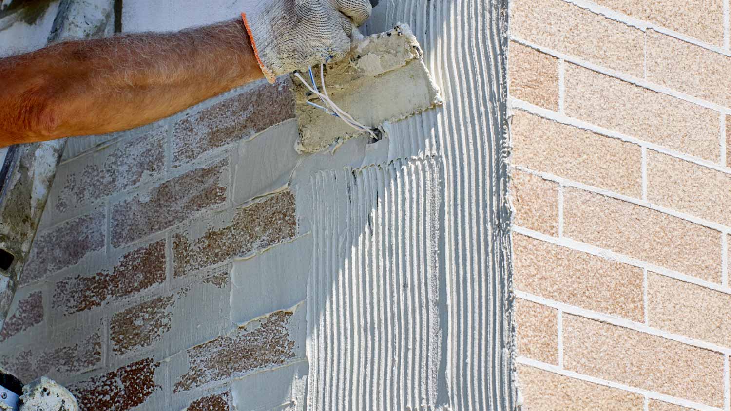 worker applying an adhesive