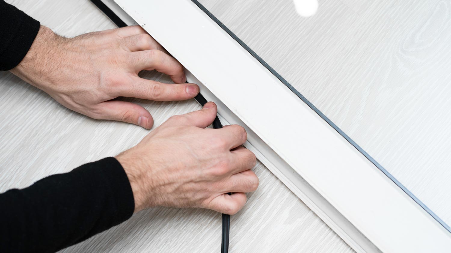 A worker changing rubber seal