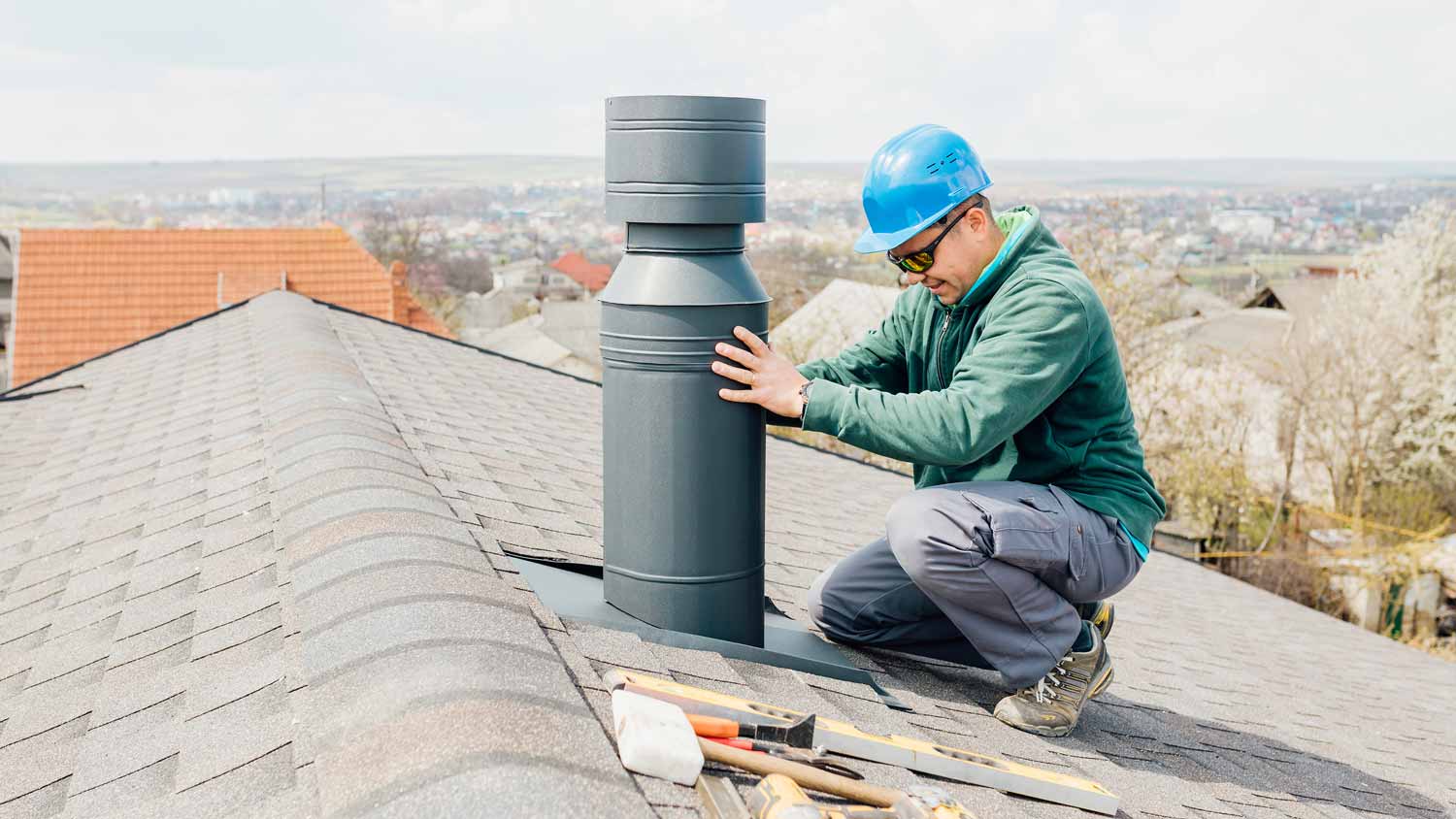 A worker inspecting an iron chimney