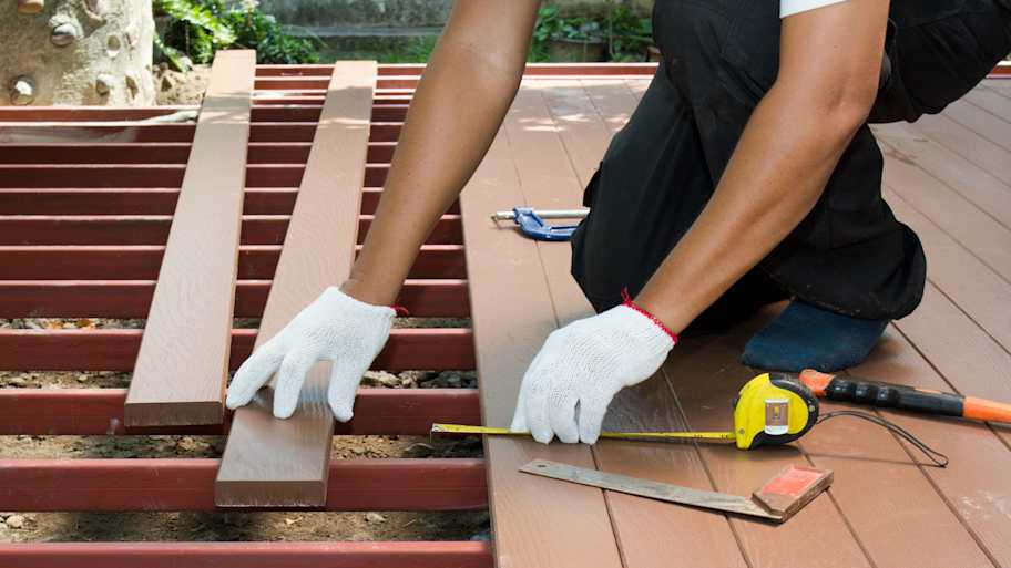 Worker installing an outdoor patio