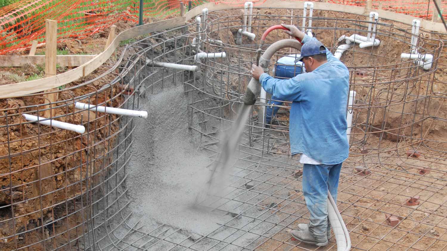 A worker working to create a suburban pool