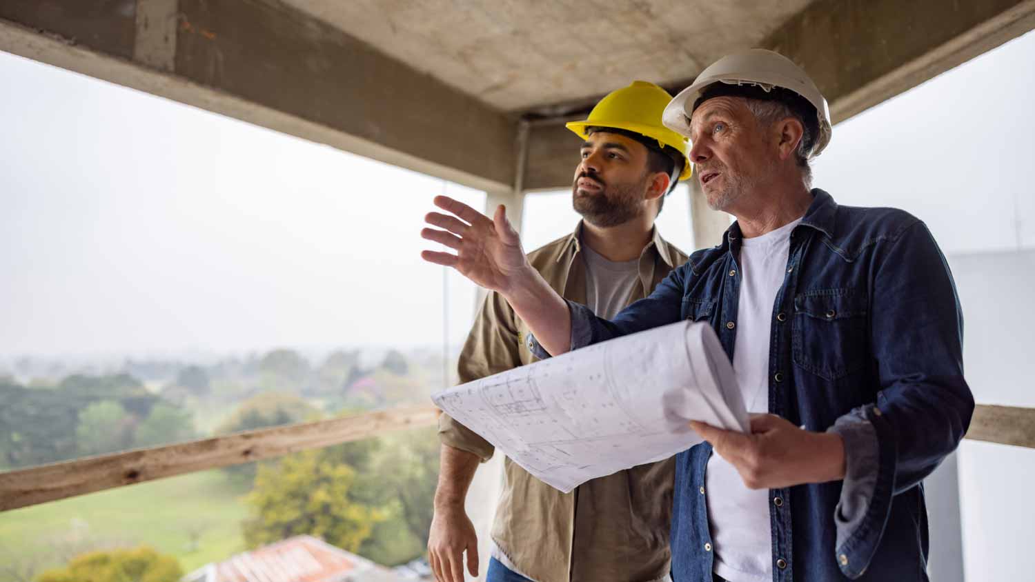 Workers looking at blueprints