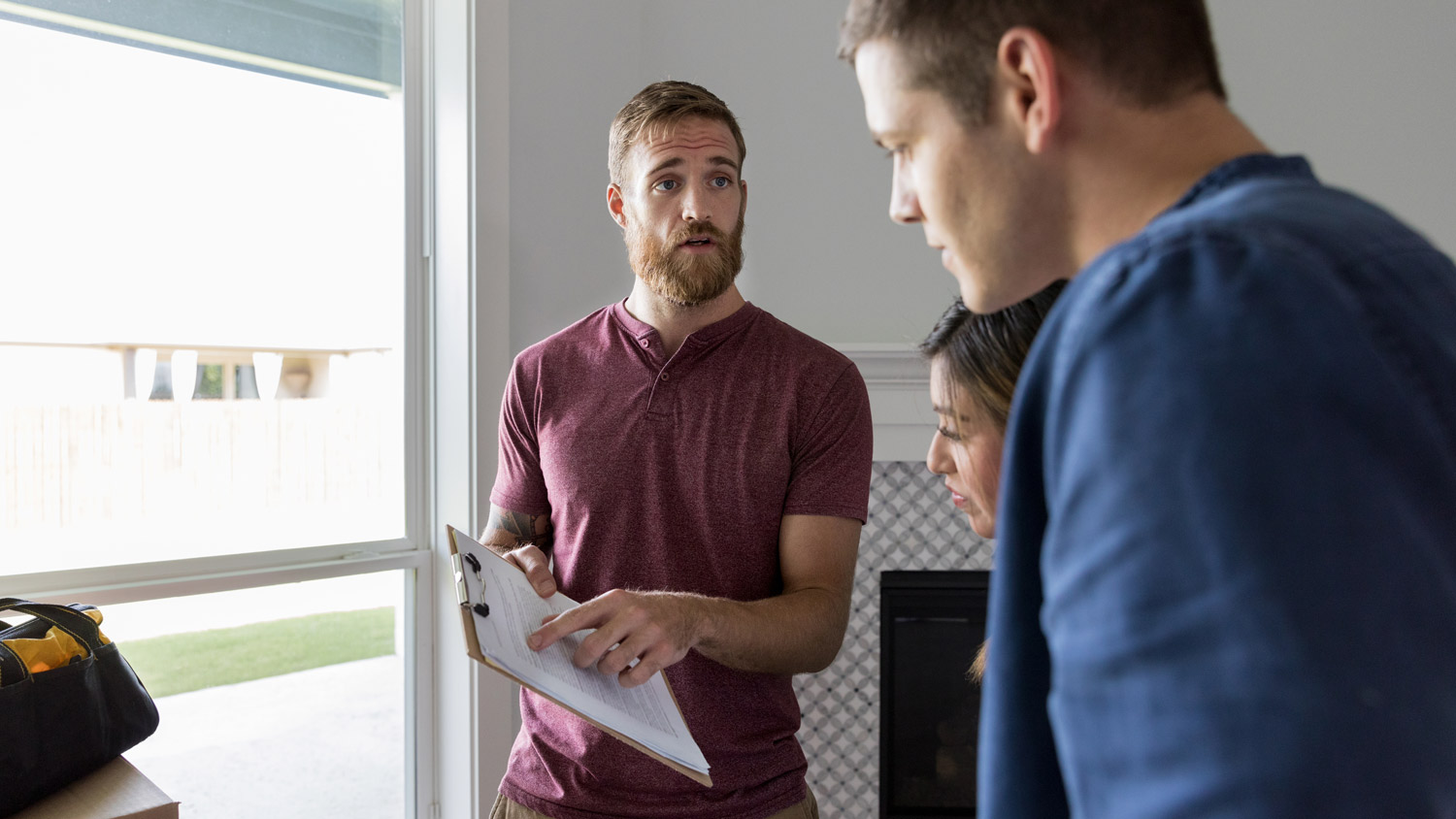 A young couple discussing with a home inspector