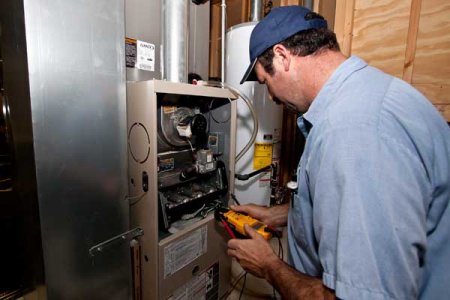 furnace repairman testing furnace