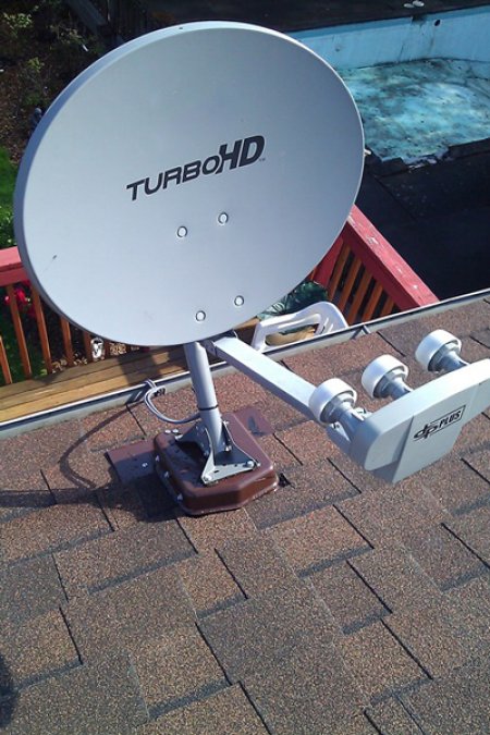 satellite dish screwed on asphalt shingle roof