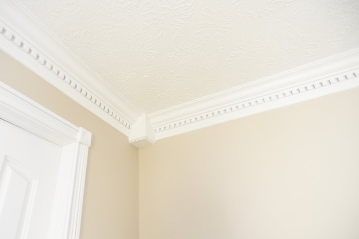 door casing and crown molding on a wall