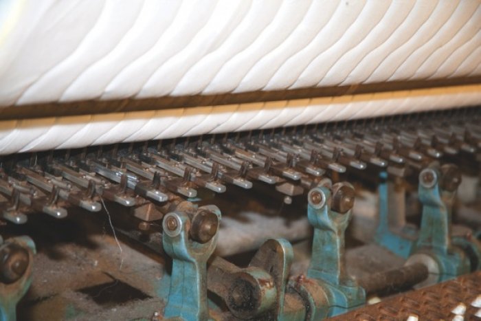 The border quilt machine is just one step among many to create new beds. (Photo by Steve C. Mitchell)