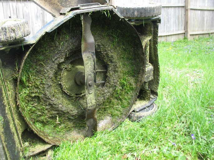 dirty lawn mower undercarriage