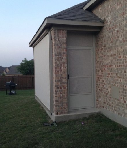 screened in patio with side entry door.