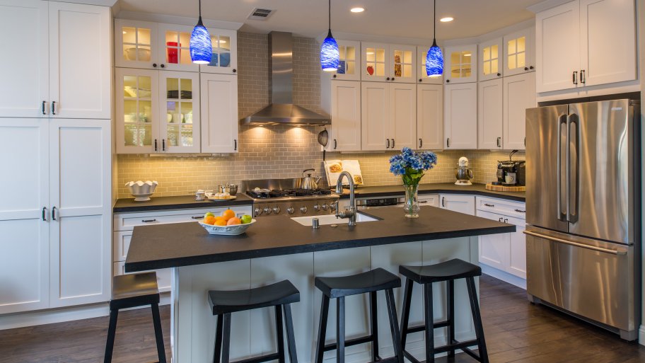 kitchen with stacked cabinets and island