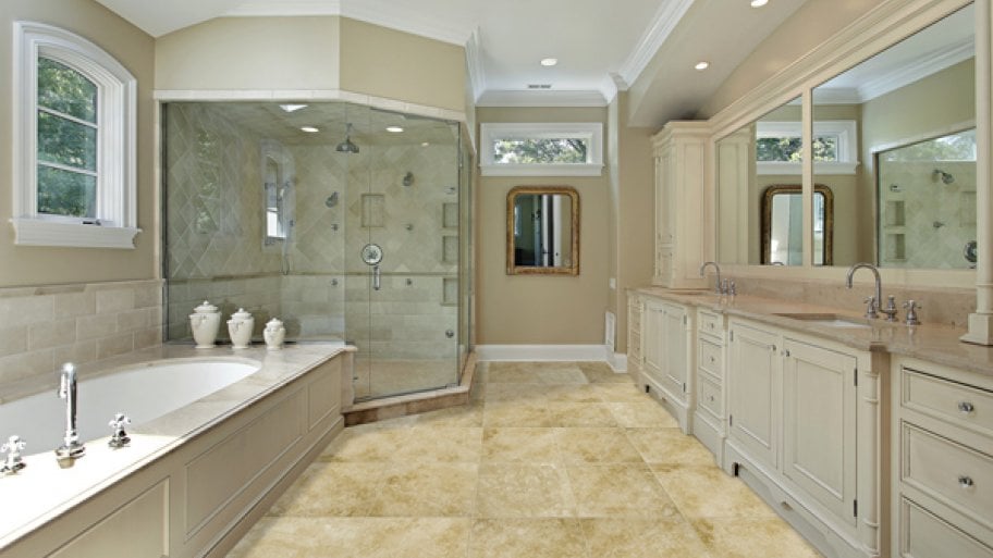 renovated bathroom with garden tub, walk-in shower, tile flooring and wood cabinetry