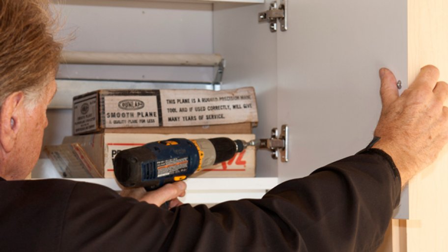 electric drill on door hinge