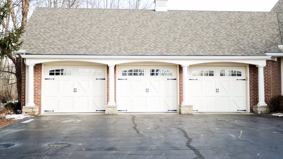 three overhead garage doors on house