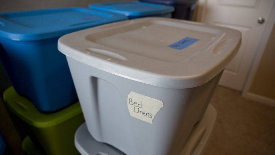 Plastic bins labeled for moving day.