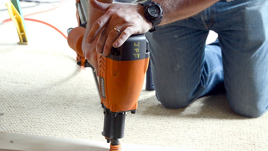 Contractor drilling into wood.