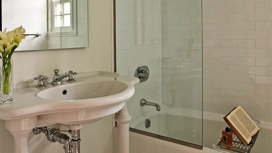 bathroom shower and tub with sink and tile floor